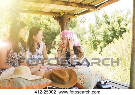 Three teenage girls playing in tree house in summer View Large Photo Image Stock Image - Three teenage girls playing in tree house in summer. Fotosearch