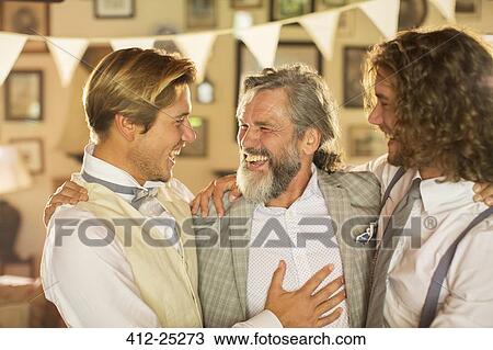 Stock Image - "Best man, bridegroom and father in domestic room". Fotosearch