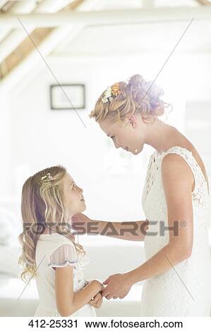 Bride talking to bridesmaid in domestic room View Large Photo Image Stock Image - Bride talking to bridesmaid in domestic room. Fotosearch