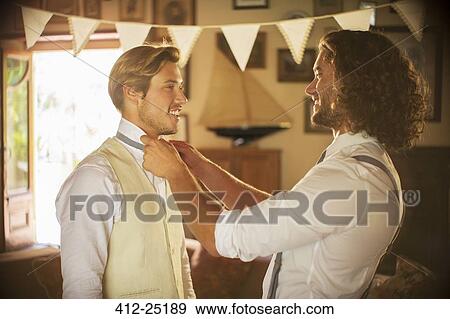 Bridegroom and best man preparing for wedding ceremony View Large Photo Image Stock Photo - Bridegroom and best man preparing for wedding ceremony. Fotosearch