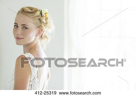 Stock Photo - Portrait of bride in domestic room. Fotosearch