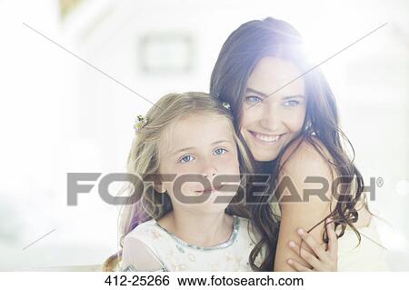 Portrait of bridesmaid and girl in domestic room View Large Photo Image Stock Photograph - Portrait of bridesmaid and girl in domestic room. Fotosearch