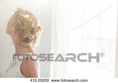 Young bride in sunny room View Large Photo Image Stock Image - Young bride in sunny room. Fotosearch