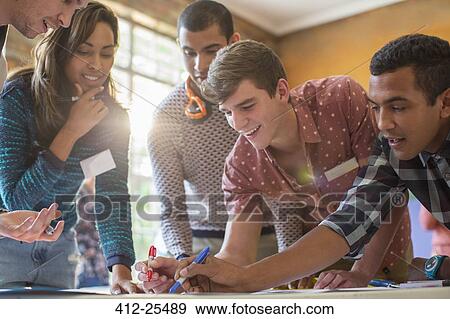 Stock Photo - Creative business people working in sunny office. Fotosearch