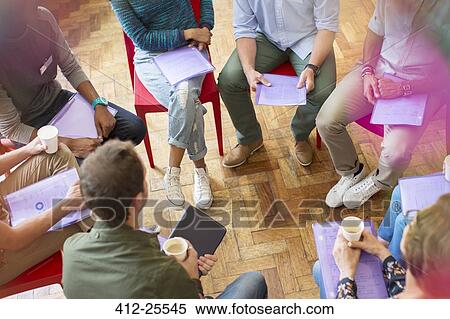Stock Photography - Group therapy session forming circle. Fotosearch