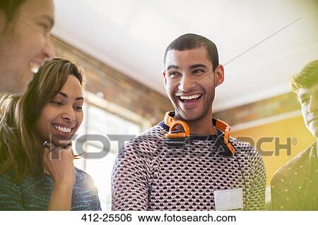Laughing casual business people in meeting View Large Photo Image Stock Photograph - Laughing casual business people in meeting. Fotosearch
