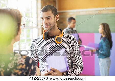 Man and woman talking in community center View Large Photo Image Stock Photograph - Man and woman talking in community center. Fotosearch
