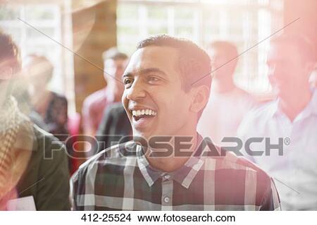Man laughing in audience View Large Photo Image Picture - Man laughing in audience. Fotosearch