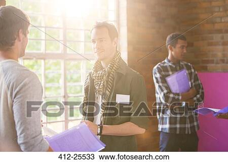 Men talking at community center View Large Photo Image Stock Image - Men talking at community center. Fotosearch