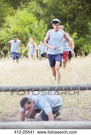 People running on boot camp obstacle course View Large Photo Image Stock Image - People running on boot camp obstacle course. Fotosearch