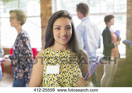 Stock Photo - Portrait of smiling woman at community center. Fotosearch