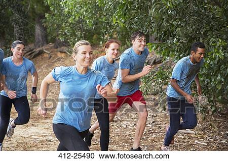 Smiling team running on boot camp obstacle course View Large Photo Image Stock Image - Smiling team running on boot camp obstacle course. Fotosearch