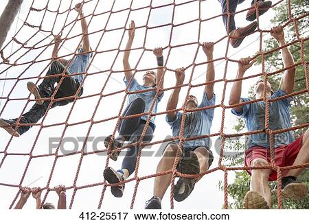 Team climbing net on boot camp course View Large Photo Image Stock Photo - Team climbing net on boot camp course. Fotosearch