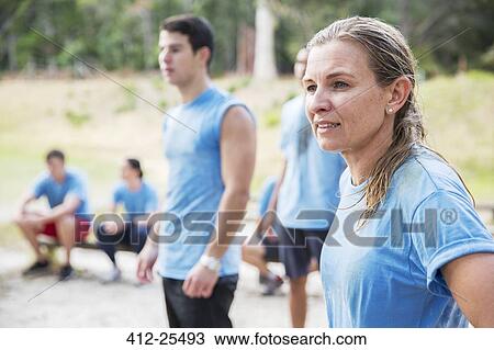 Woman looking away at boot camp View Large Photo Image Stock Image - Woman looking away at boot camp. Fotosearch