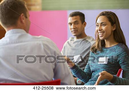 Stock Photo - Woman speaking in meeting. Fotosearch