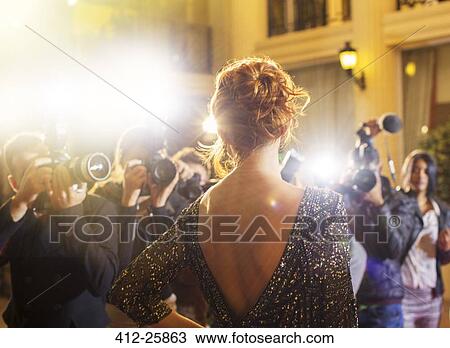 Celebrity being photographed by paparazzi photographers at event View Large Photo Image Stock Image - Celebrity being photographed by paparazzi photographers at event. Fotosearch
