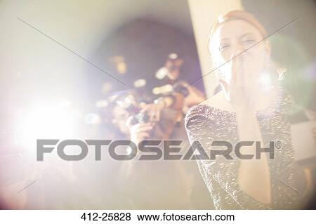 Celebrity blowing a kiss to paparazzi photographers View Large Photo Image Stock Photo - Celebrity blowing a kiss to paparazzi photographers. Fotosearch