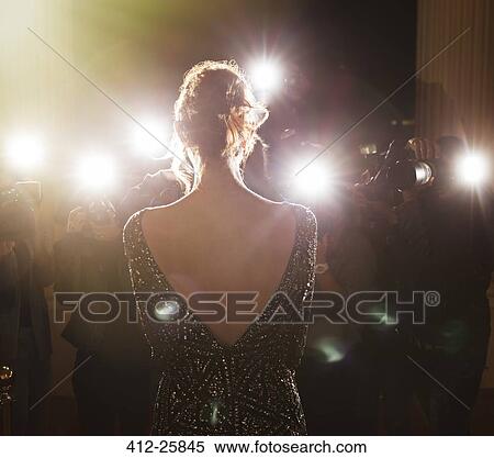 Celebrity facing paparazzi photographers at event View Large Photo Image Stock Photography - Celebrity facing paparazzi photographers at event. Fotosearch