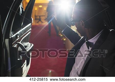 Celebrity in limousine arriving at red carpet event and waving to photographing paparazzi View Large Photo Image Stock Photography - Celebrity in limousine arriving at red carpet event and waving to photographing paparazzi. Fotosearch