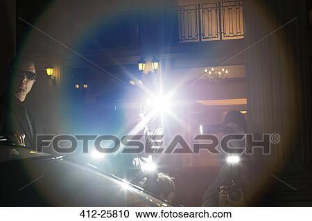 Lens flare from paparazzi photographing at event View Large Photo Image Stock Image - Lens flare from paparazzi photographing at event. Fotosearch