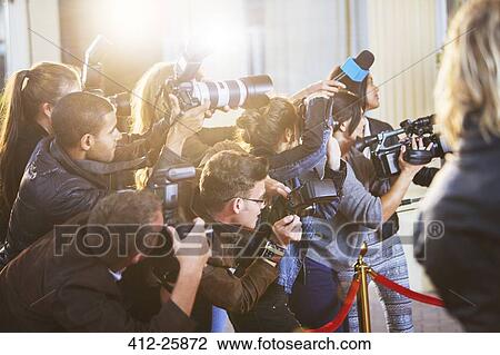 Paparazzi photographers at red carpet event View Large Photo Image Stock Image - Paparazzi photographers at red carpet event. Fotosearch