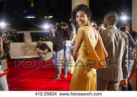 Portrait of smiling celebrity leaving red carpet event View Large Photo Image Picture - Portrait of smiling celebrity leaving red carpet event. Fotosearch