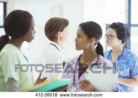 Doctor and nurses talking in hospital View Large Photo Image Stock Photo - Doctor and nurses talking in hospital. Fotosearch