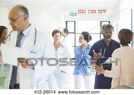 Doctors and nurses in hospital corridor View Large Photo Image Picture - Doctors and nurses in hospital corridor. Fotosearch