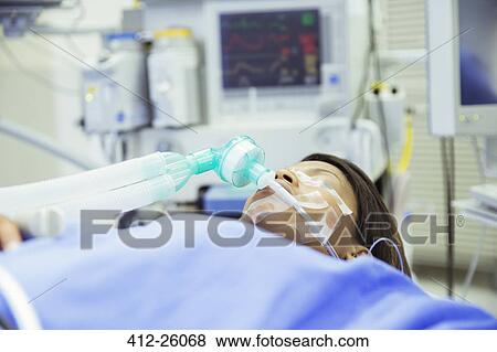 Patient with oxygen mask in operating room View Large Photo Image Stock Photo - Patient with oxygen mask in operating room. Fotosearch
