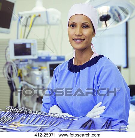 Portrait of confident surgeon near surgical scissors in operating room View Large Photo Image Stock Image - Portrait of confident surgeon near surgical scissors in operating room. Fotosearch