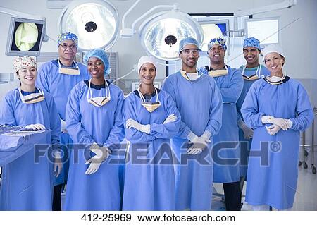 Portrait of confident team of surgeons in operating room View Large Photo Image Stock Photo - Portrait of confident team of surgeons in operating room. Fotosearch