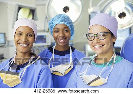 Portrait of smiling female surgeons in operating room View Large Photo Image Stock Photography - Portrait of smiling female surgeons in operating room. Fotosearch