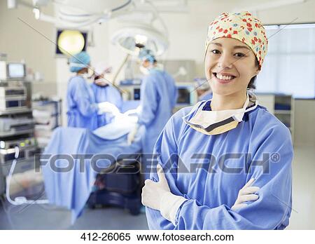 Portrait of smiling surgeon in operating room View Large Photo Image Stock Photography - Portrait of smiling surgeon in operating room. Fotosearch