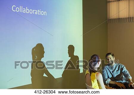 Picture - Business people discussing Collaboration in audio visual presentation. Fotosearch