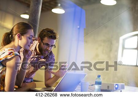 Business people working at laptop View Large Photo Image Stock Photo - Business people working at laptop. Fotosearch