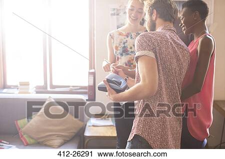 Creative business people looking at instant photo View Large Photo Image Stock Image - Creative business people looking at instant photo. Fotosearch