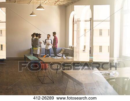 Creative business people meeting in office View Large Photo Image Stock Photo - Creative business people meeting in office. Fotosearch