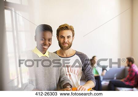 Portrait confident casual businessman and businesswoman in office View Large Photo Image Stock Image - Portrait confident casual businessman and businesswoman in office. Fotosearch