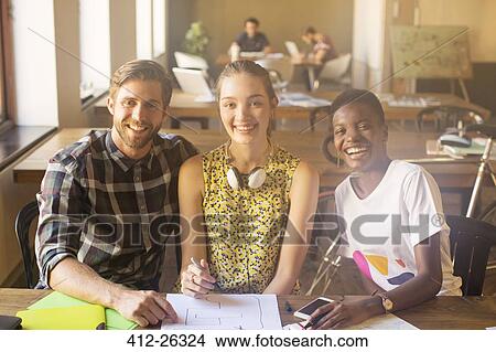 Portrait smiling creative business people working in office View Large Photo Image Picture - Portrait smiling creative business people working in office. Fotosearch