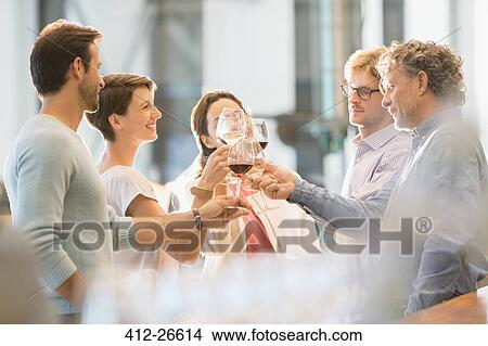 Picture - Friends toasting wine glasses. Fotosearch