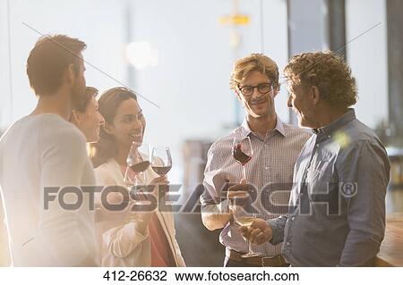 Friends wine tasting in winery tasting room View Large Photo Image Stock Image - Friends wine tasting in winery tasting room. Fotosearch