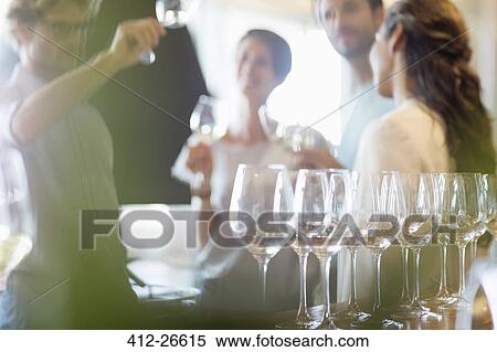 Friends wine tasting in winery tasting room View Large Photo Image Stock Photography - Friends wine tasting in winery tasting room. Fotosearch