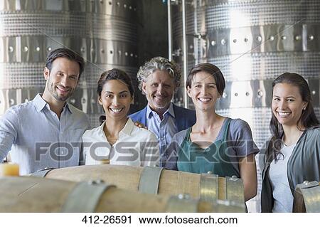 Portrait confident winery employees in cellar View Large Photo Image Stock Image - Portrait confident winery employees in cellar. Fotosearch