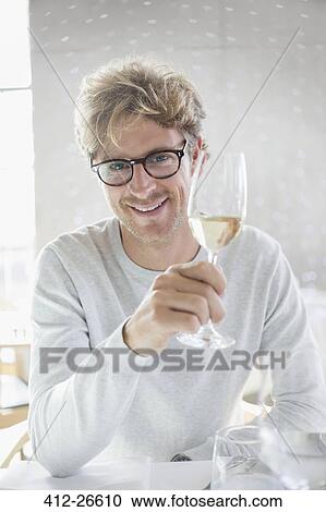 Portrait smiling man drinking white wine View Large Photo Image Stock Image - Portrait smiling man drinking white wine. Fotosearch
