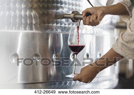 Vintner barrel tasting red wine from stainless steel vat View Large Photo Image Stock Photo - Vintner barrel tasting red wine from stainless steel vat. Fotosearch