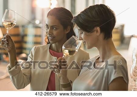 Women wine tasting at winery View Large Photo Image Stock Photo - Women wine tasting at winery. Fotosearch
