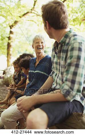 Picture - Mother and son laughing in woods. Fotosearch