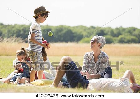 Multi-generation family in sunny field View Large Photo Image Stock Photograph - Multi-generation family in sunny field. Fotosearch
