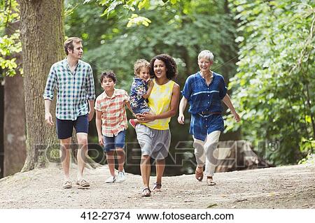 Multi-generation family walking in woods View Large Photo Image Picture - Multi-generation family walking in woods. Fotosearch