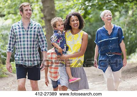 Multi-generation family walking in woods View Large Photo Image Stock Photo - Multi-generation family walking in woods. Fotosearch